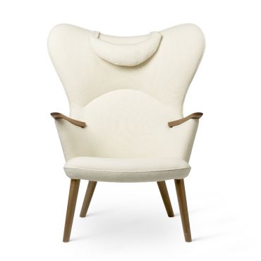 The Carl Hansen CH78 Mama Bear Lounge Chair with walnut legs and upholstered in Hallingdal 100, with neck cushion in the same fabric.